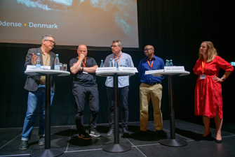 Speakers at a conference